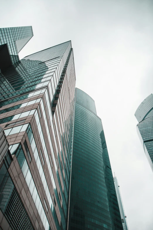 looking up at two buildings from the ground