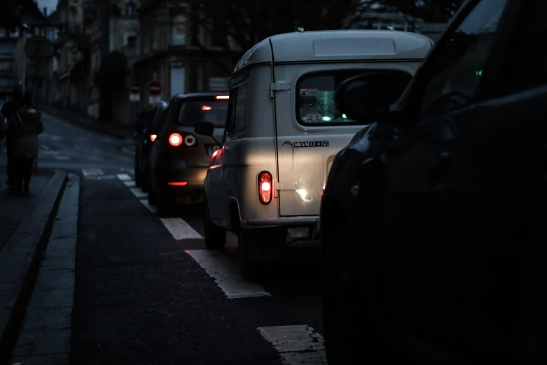 a car and a bus are on the street