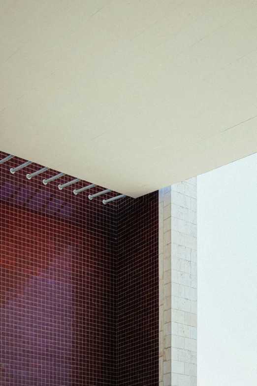 a red shower curtain in a white tiled shower