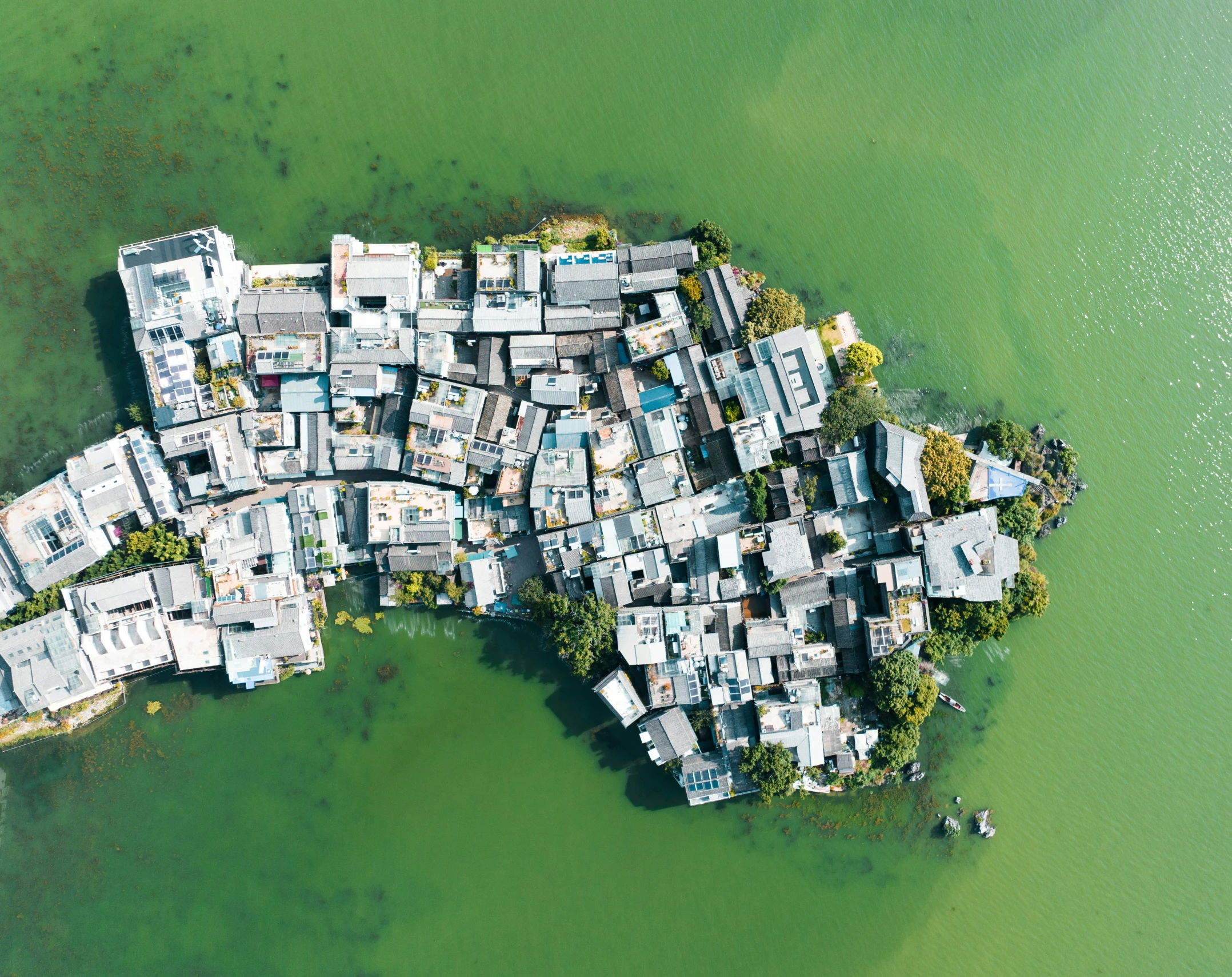 aerial view of several buildings built into the water