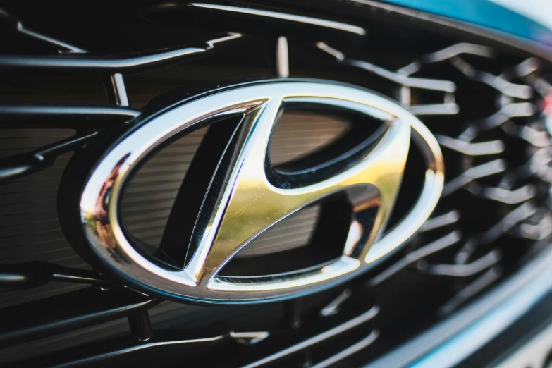 the front grill and emblem of a used toyota