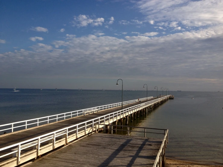 the long boardwalk at the pier is empty