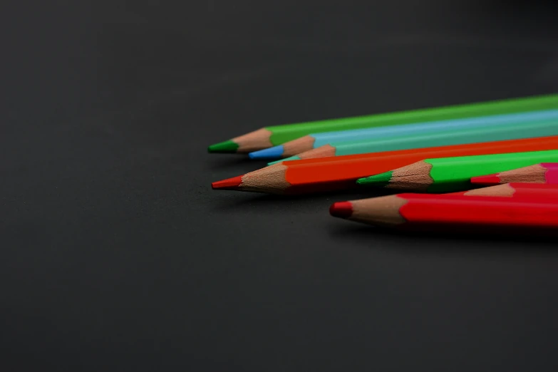 closeup of colored pencils with black background