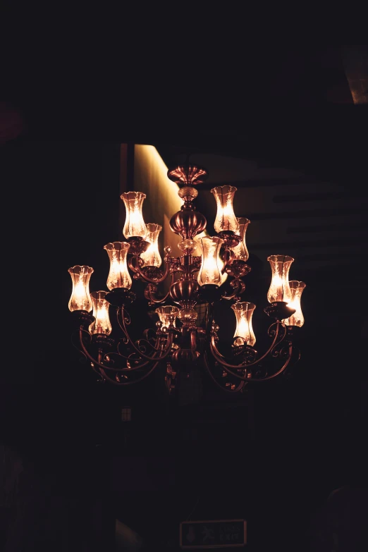 an old chandelier with many lights on it