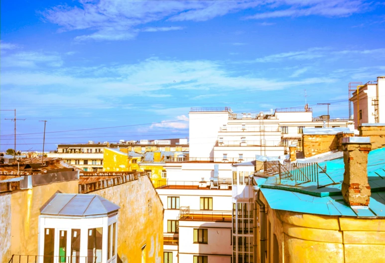 the tops of buildings against a blue sky