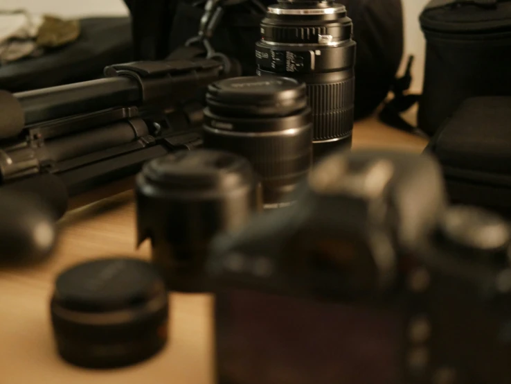 many different objects sitting on a table and a camera