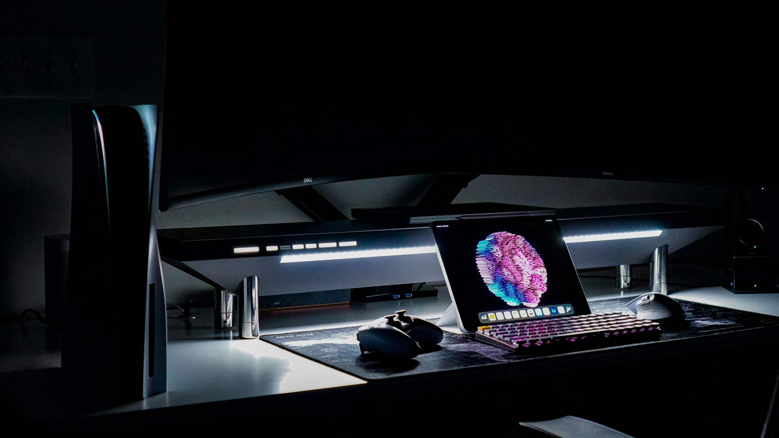 an image of a laptop on a desk in the dark