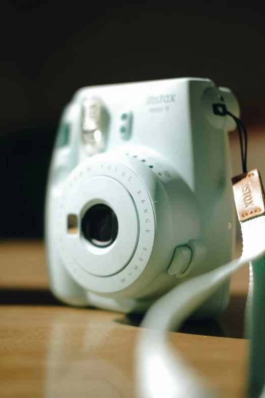 a small camera sitting on top of a wooden table