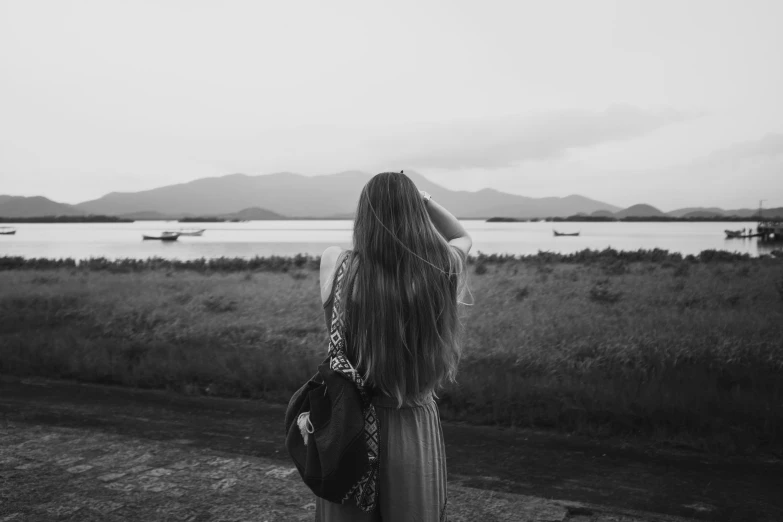 the back of a woman's head that is over her head