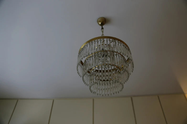 an elaborate light fixture hanging from a ceiling