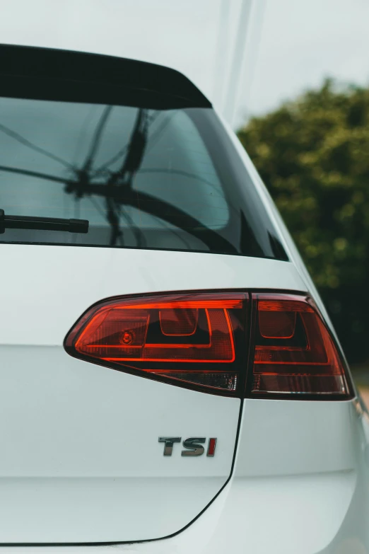 the taillights on a white car are shown