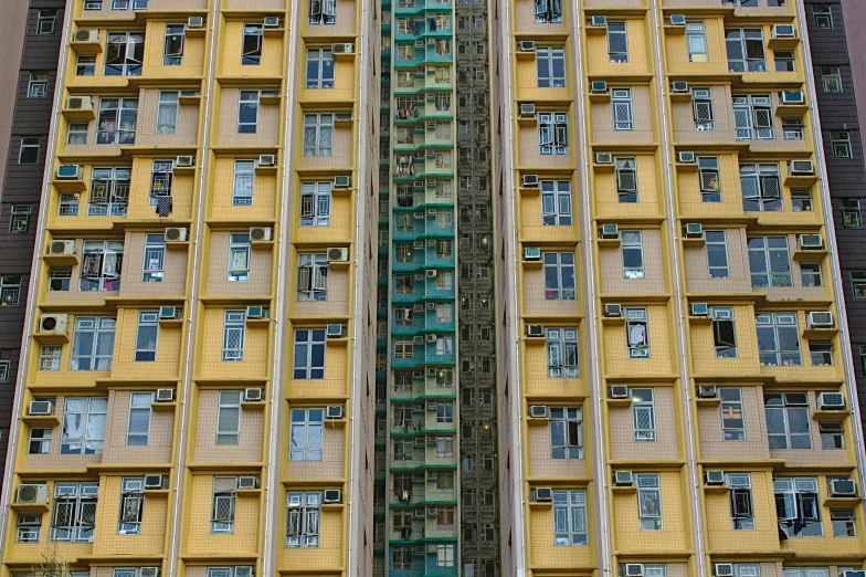 the bottom of two tall buildings are colored yellow and brown