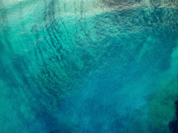 an aerial view from above looking down at the surface of the ocean