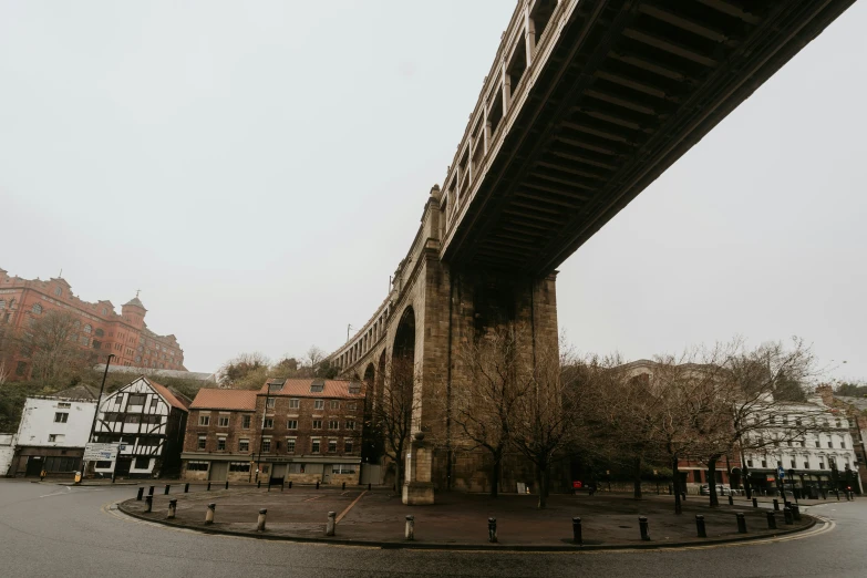 a bridge spanning over the width of buildings in a city