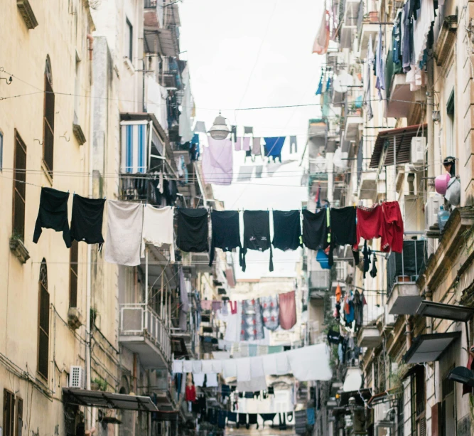 clothes line a city street lined with apartment buildings