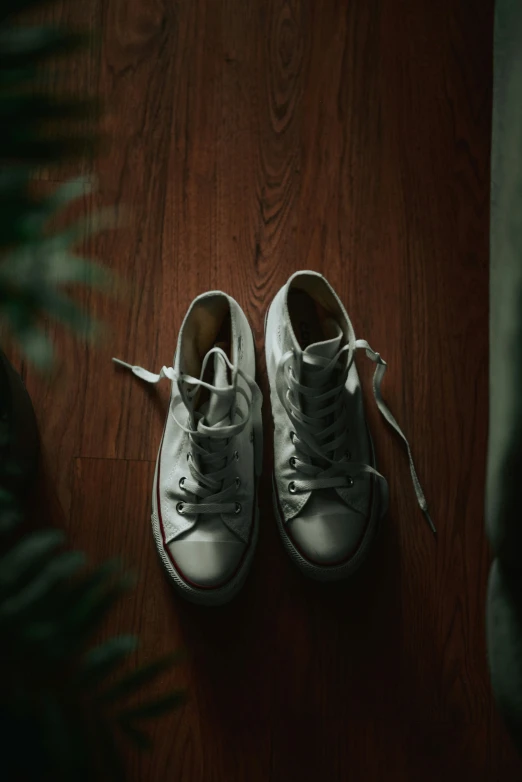 a pair of sneakers that are on a table