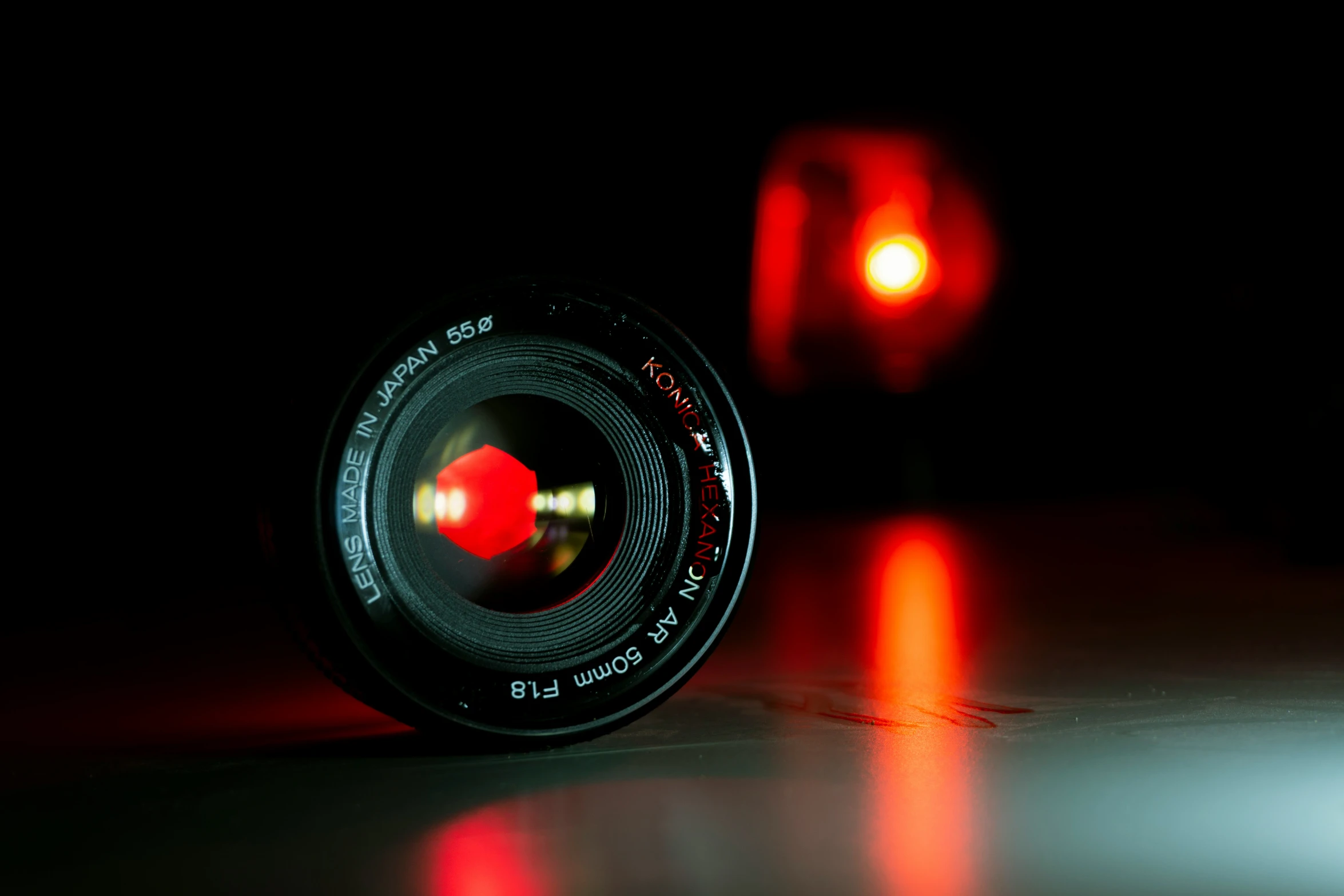 two light and a lens are seen against the darkness