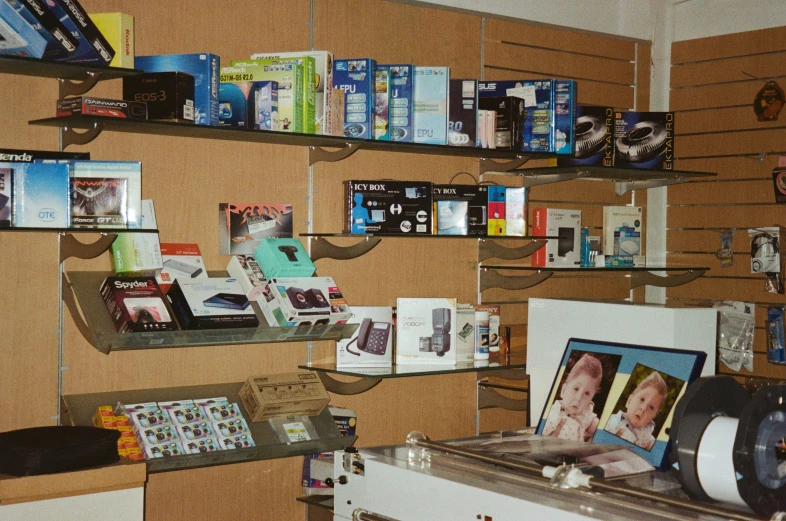 a wall with shelves with pos and a box inside of it