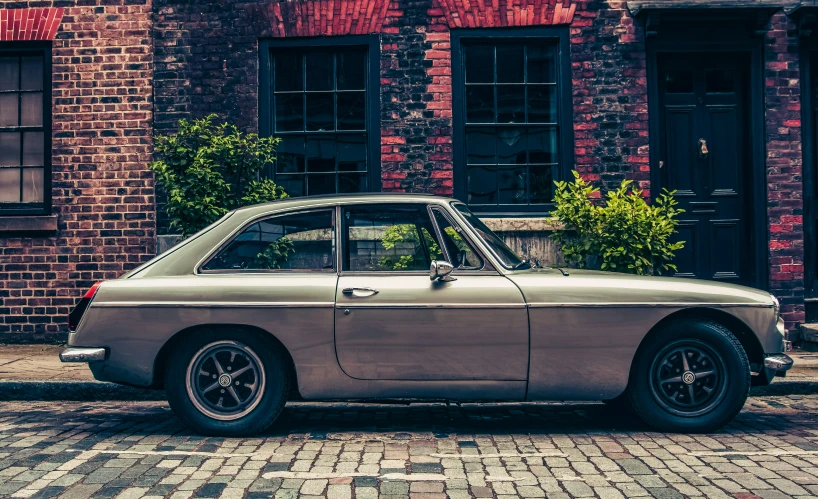 an old car parked on the side of the road