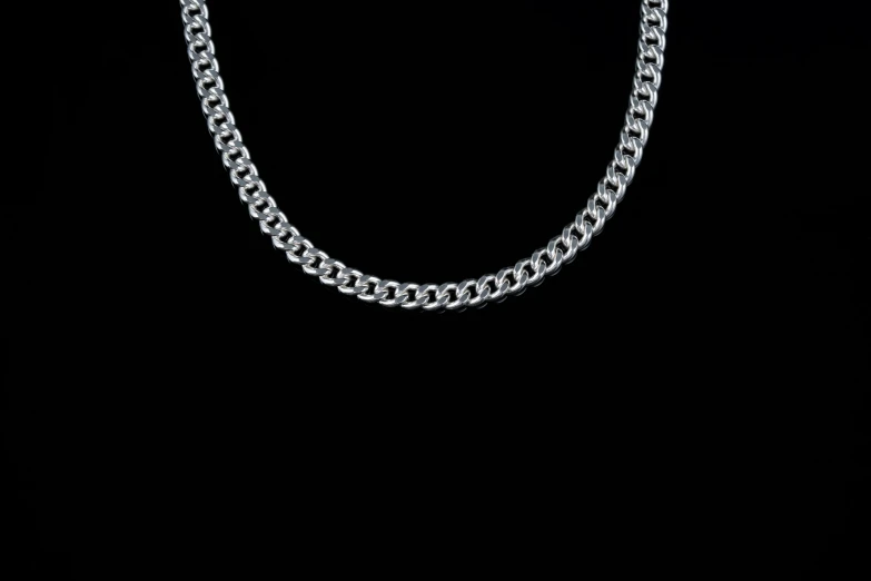 a large silver chain with a round design