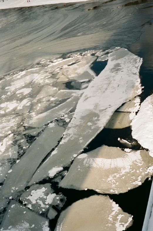 an ice field in winter with water and snow