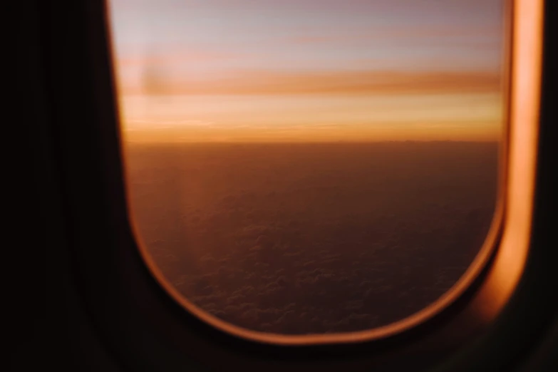 an airplane wing showing a view of the sky