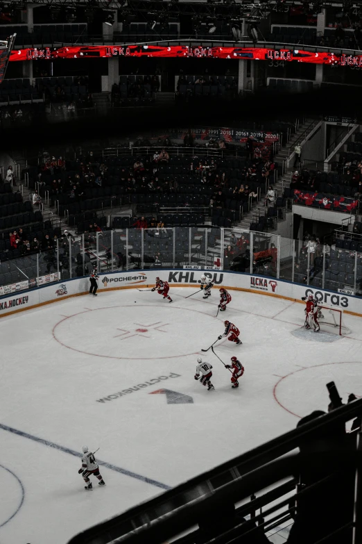 a hockey game being played on a snowy rink