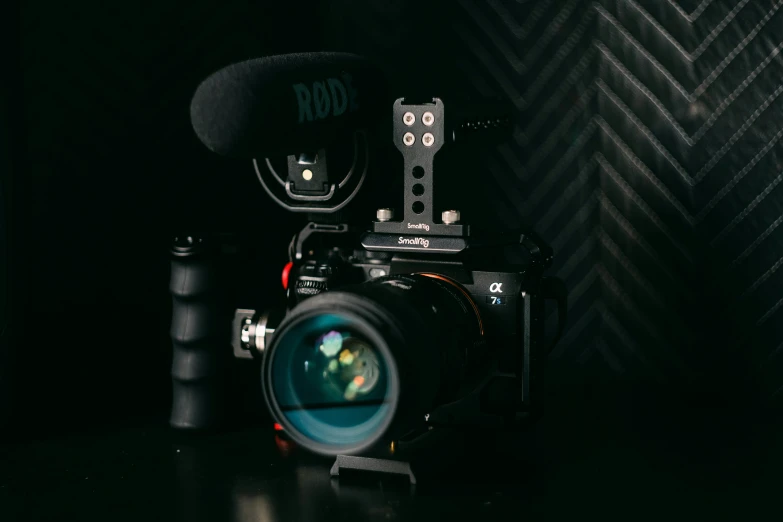 an analog camera with a black background