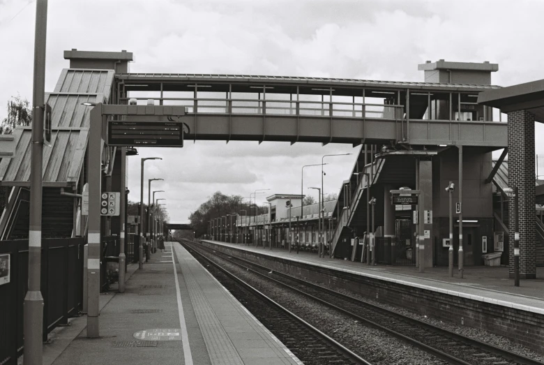 an old black and white pograph of train tracks