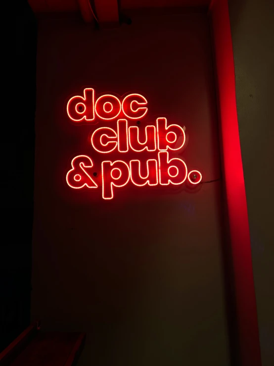 the words doc club and pub in neon lights