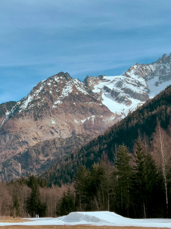 a snow covered mountain range in the distance