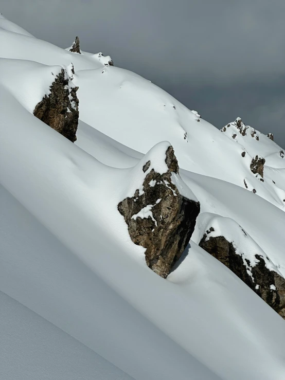 a bunch of rocks sitting in the snow