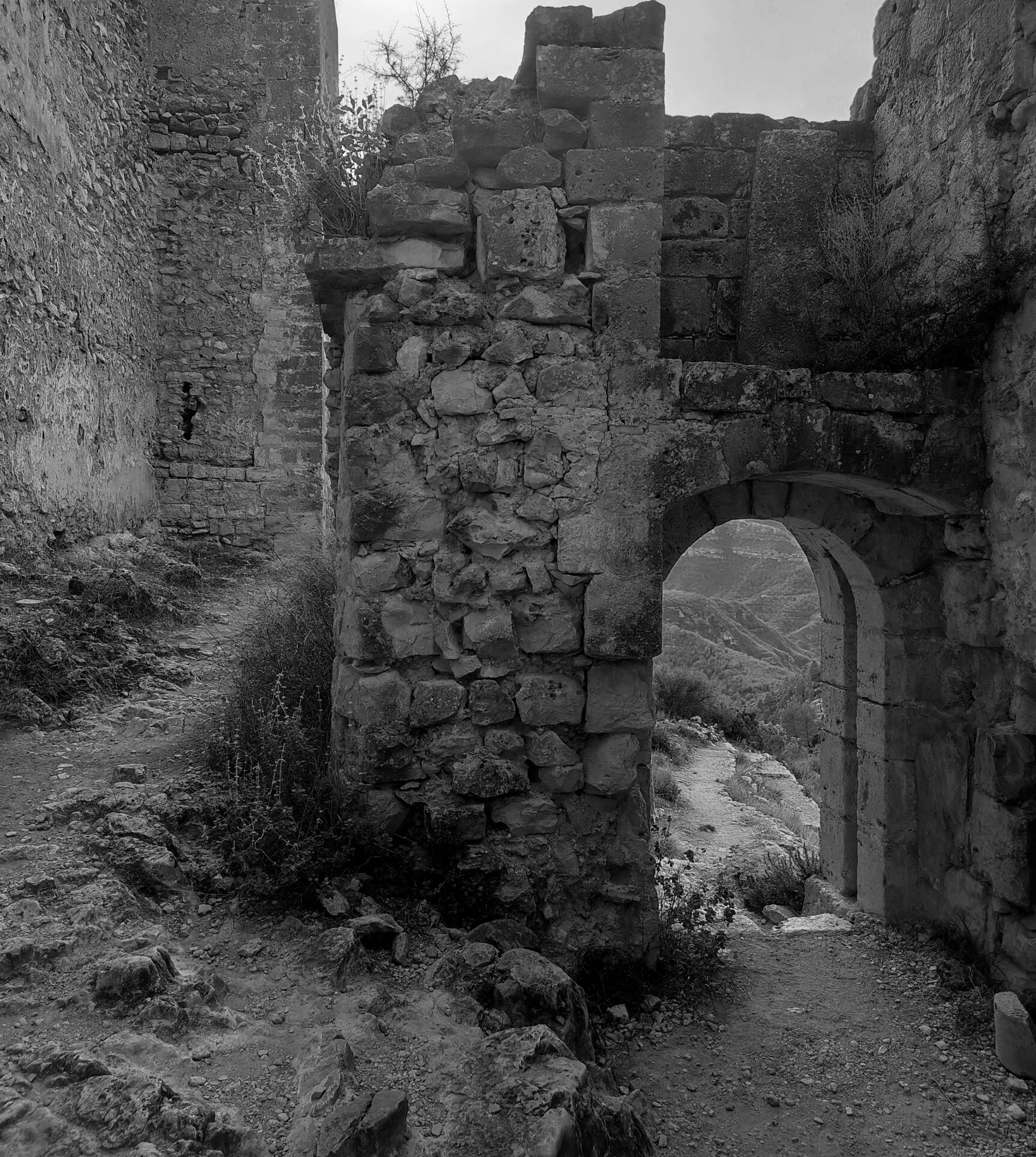 an old stone castle sitting on top of a hill