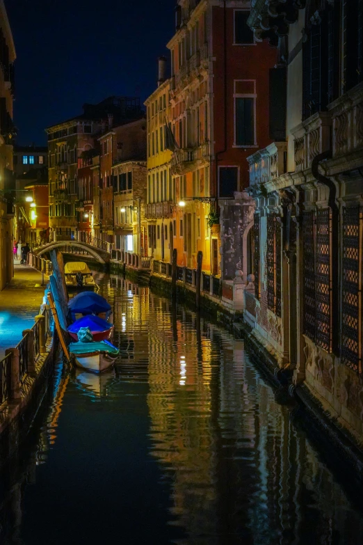 the lights on the buildings glow brightly in the water