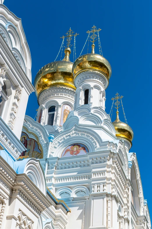 an ornate cathedral, painted in gold and white