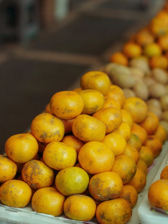 a stand displays many different types of fruit