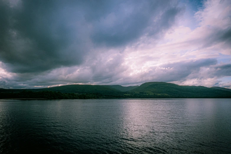 dark clouds gathering over a large body of water