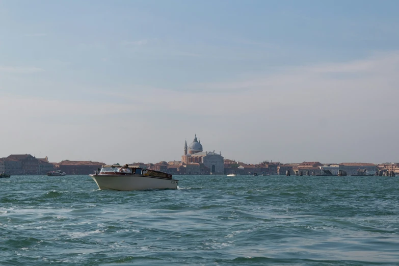 a boat sailing across a large body of water