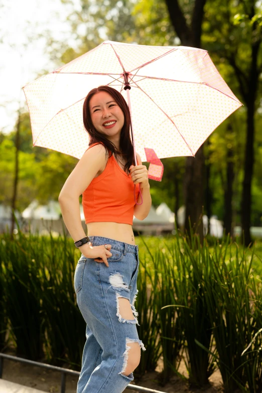 a girl is posing with a white umbrella