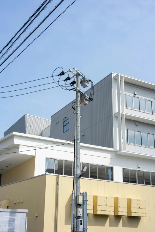 a yellow building is shown with an odd shape