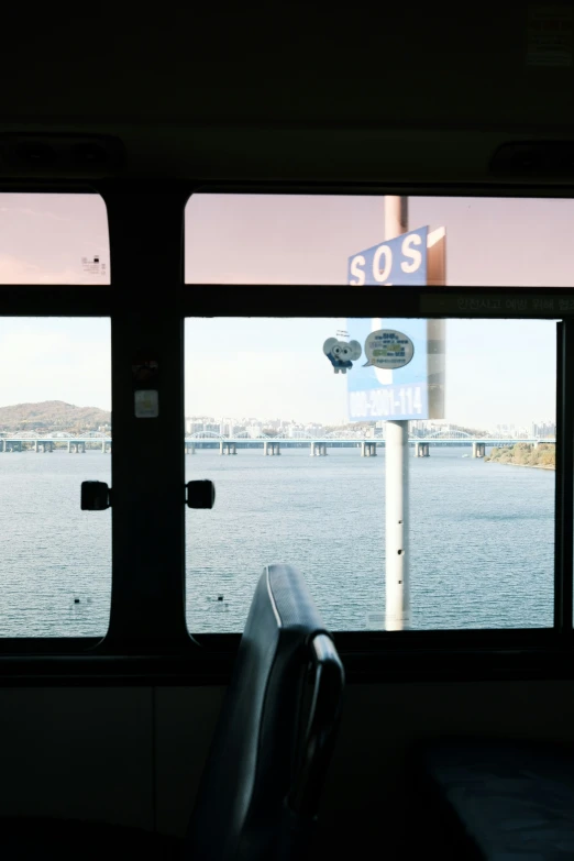 view from inside a bus, of the water and pier