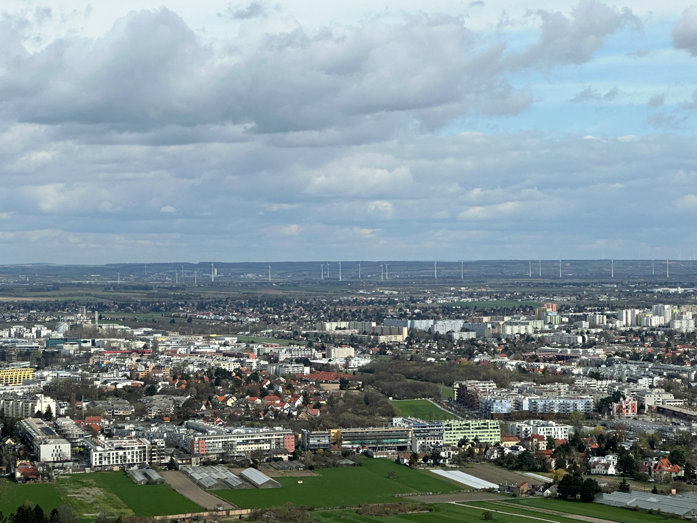 the city below is all white with wind mills