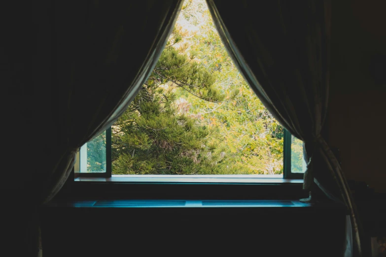 an open window overlooking the valley outside