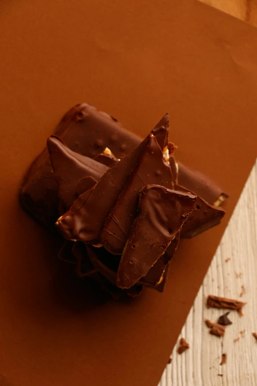 two pieces of chocolate sitting on top of each other