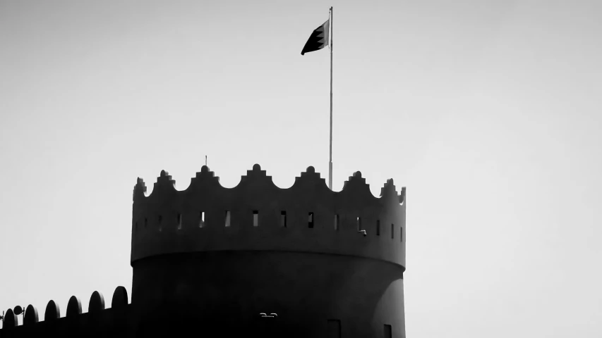 there is a flag flying on top of the castle