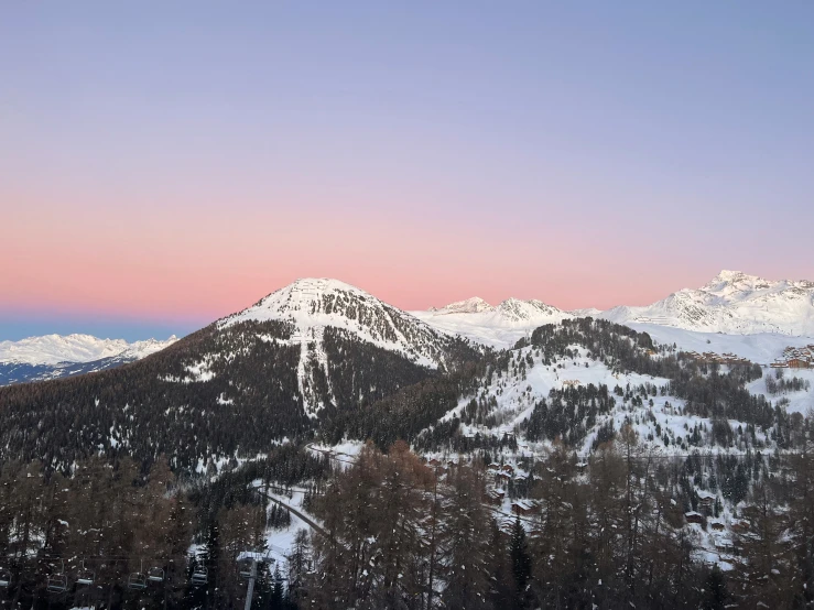 mountains in the distance are covered with snow