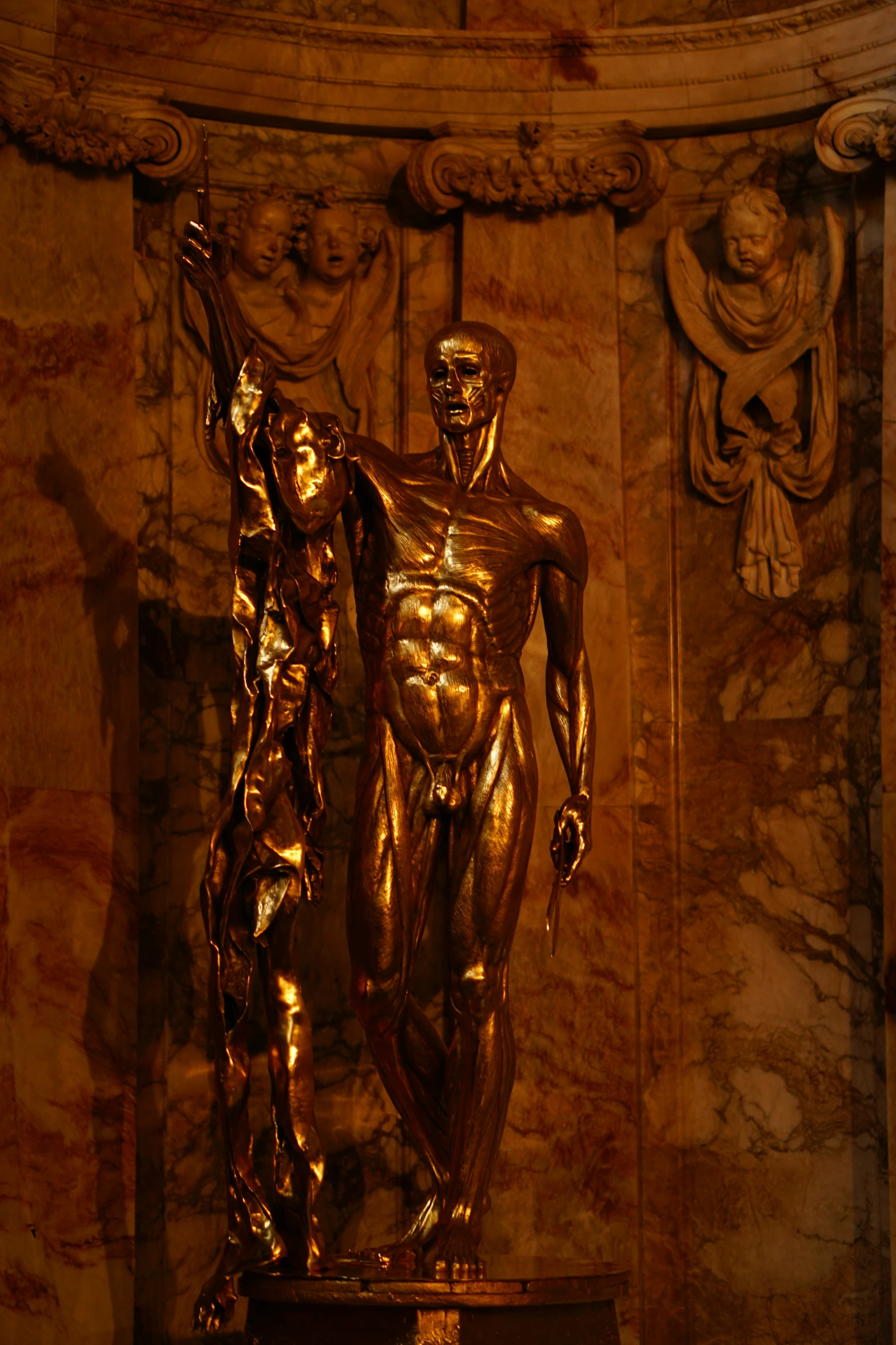 a statue of a man standing next to another man