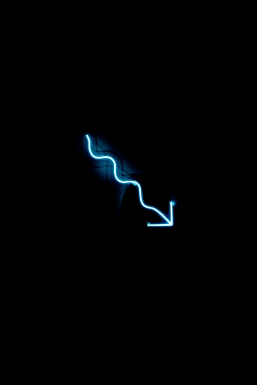the back of a neon sign at night