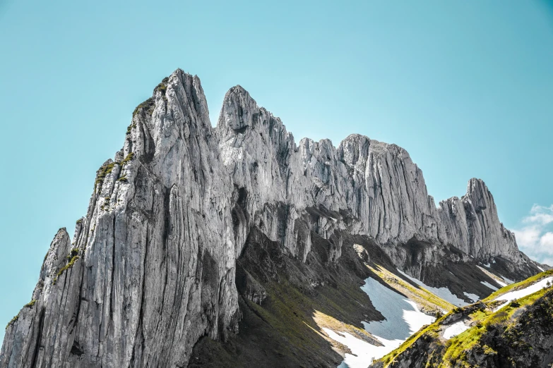 mountain range with a few steep rocks on the side