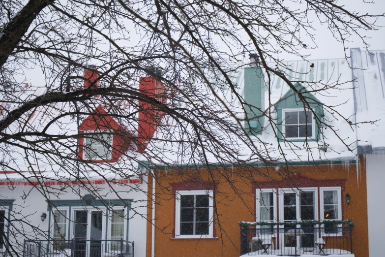 a tall building with windows and snow on the ground